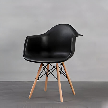Modern black studio seat with ergonomic molded seat and wooden legs, designed for offices and workspaces.